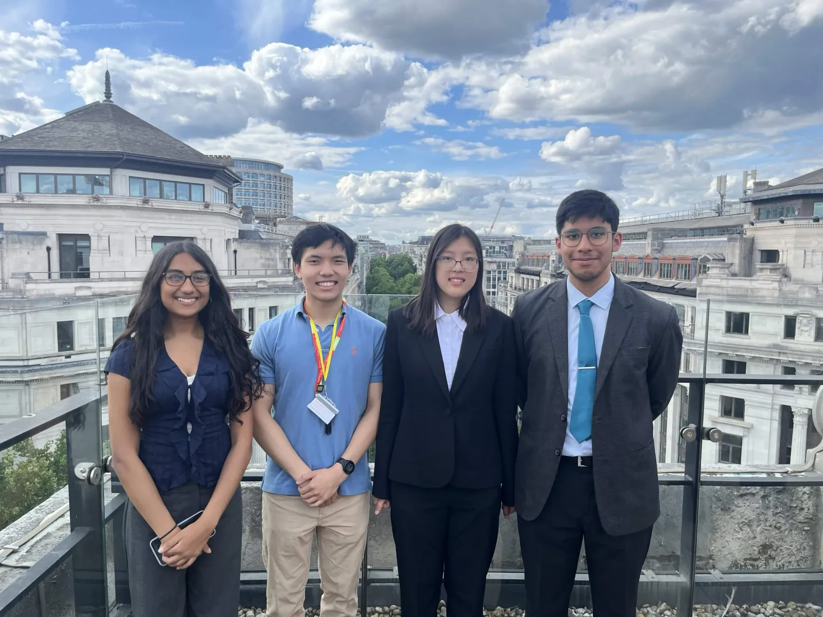 Four of the KCLMS Volcanix team leads on a London rooftop